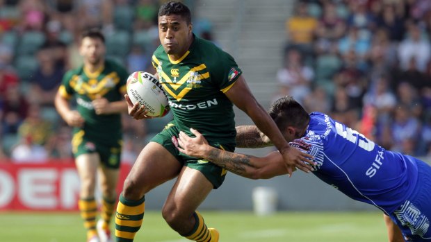 Kangaroo: Michael Jennings takes on Samoa with Australia in the Four Nations in 2014. 