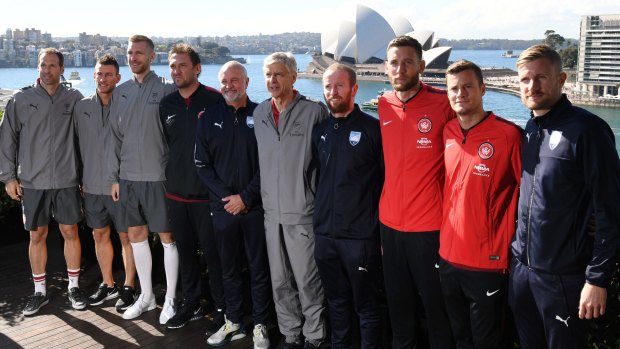 Engagement: Arsene Wenger poses with Petr Cech, Laurent Koscielny, Per Mertesacker, Graham Arnold, Tony Popovic and Sydney FC and Wanderers players.