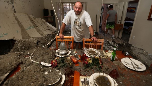 Frank Partlic stands in his ruined home at Kurnell.