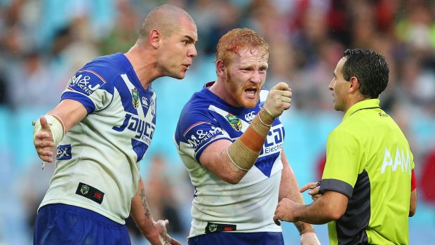 Bulldogs players David Klemmer and James Graham confront referee Gerard Sutton in a memorable Good Friday clash in 2015.