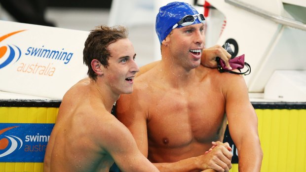 Cameron McEvoy and Grant Hackett celebrate following the men's 200m freestyle final at Sydney Olympic Park Aquatic Centre.