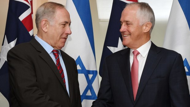 Israeli Prime Minister Benjamin Netanyahu, left, and Australian Prime Minister Malcolm Turnbull shake hands during the signing of agreements between the two countries at the Commonwealth Parliamentary offices in Sydney last week.