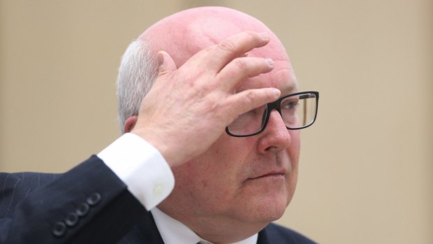 Attorney-General Senator George Brandis looks just how we feel after watching hours of debate about the word "consult".