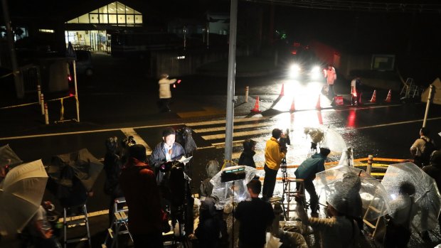 Media members gather in front of Tsukui Yamayuri En care home in Sagamihara, Japan. 