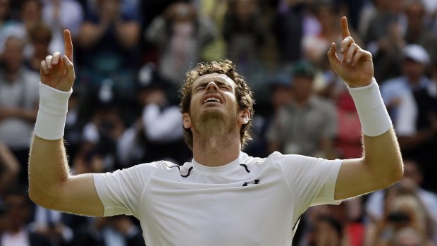 Andy Murray celebrates winning match point against Milos Raonic in the 2016 men's singles final at Wimbledon.