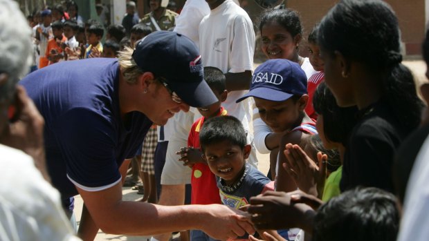 Shane Warne visiting a tsunami refugee camp in southern Sri Lanka in 2005. The Shane Warne Foundation donated money to the aid effort. 