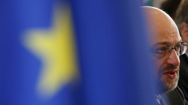 EU parliament president Martin Schulz is seen behind an European Union flag as he speaks at a news conference in Beijing.