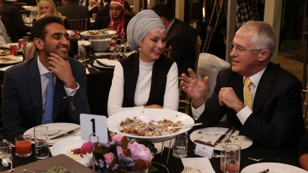 Malcolm Turnbull, pictured with Waleed Aly and his wife Susan Carland, at the Iftar dinner.