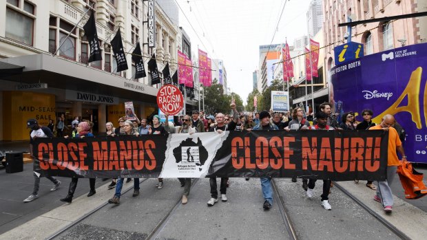 Refugee protest against the recent shootings on Manus Island. Protesters marching through the city.