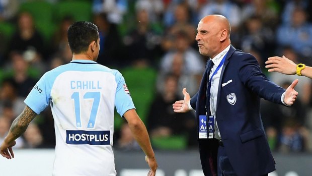 Victory coach Kevin Muscat exchanges words with City star Tim Cahill after the controversial decision.
