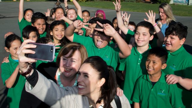 Ardern poses for a selfie with students in Christchurch.