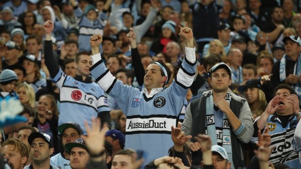 True black, white and blue: Sharks supporters cheer during the NRL Preliminary Final match against the North Queensland Cowboys at Allianz Stadium.