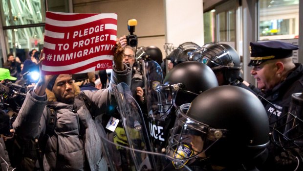 New York City Councilman Jumaane Williams, centre, joined demonstrators protesting outside JFK Airport in New York.