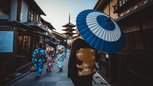 Kimono-clad women in downtown Kyoto.