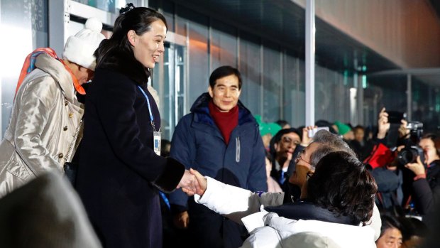 Kim, left, shakes hands with Moon Jae-in at the opening ceremony of the 2018 Winter Olympics in Pyeongchang.