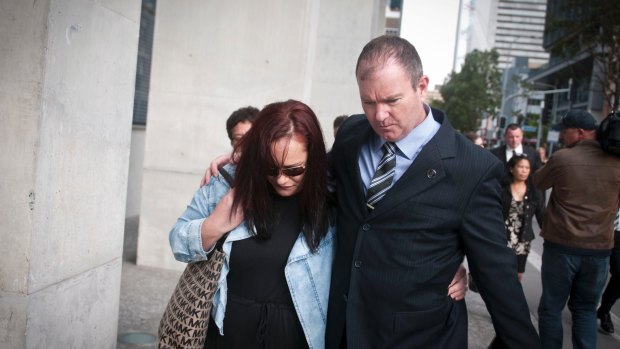 Detective Inspector Damien Hansen leaving court with members of Warriena Wright's family.