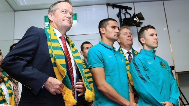 Looking ahead: Socceroos Tim Cahill and Matt McKay with the Leader of the Opposition Bill Shorten during a visit to Parliament House on Monday.