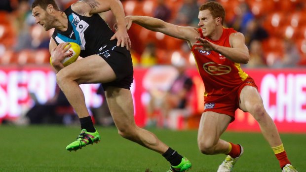 Port Adelaide and the Gold Coast Suns will meet next year in an unlikely AFL clash in Shanghai.
