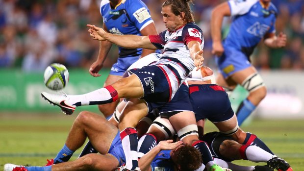 Melbourne Rebels' Ben Meehan clears the ball in the match against Western Force on Saturday night.
