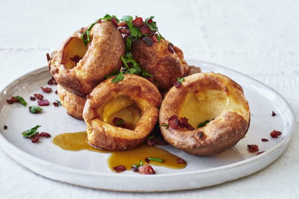 Popover yorkies with sizzling bacon and maple syup.