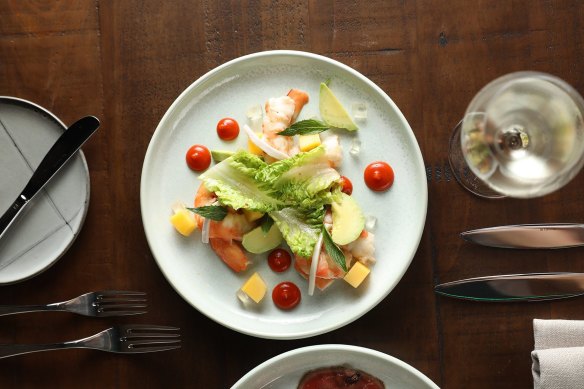 Ballina king prawns, roasted capsicum, chilli dressing, mango, avocado, fresh coconut, coconut jelly, baby cos lettuce and muoccham dressing.