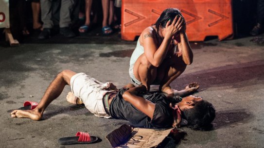 The killers had written "drug pusher" on a piece of cardboard and left it beside Michael Siaron.