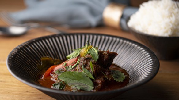 Pork curry with tomatillos, makrut lime leaves and holy basil. 