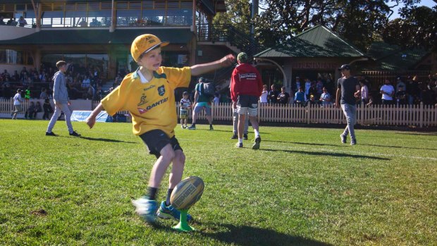 Adama Grace, 7, at North Sydney Oval on the day of the Shute Shield grand final.