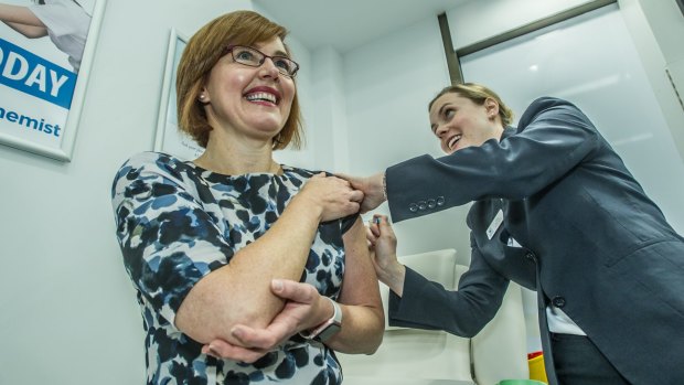 Minister for Health and Wellbeing, Meegan Fitzharris announces that ACT pharmacists with appropriate training may now administer Pertussis (whooping cough) vaccine to adults, without a prescription. Chemist Elise Apolloni administers an injection at the Wanniassa Capital Chemist. 
