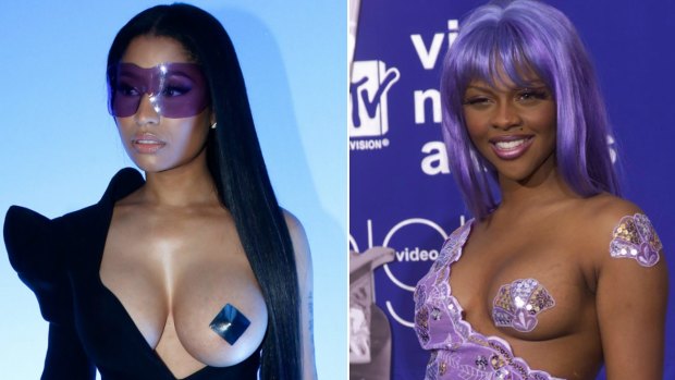 Nicki Minaj Channels Lil' Kim, Exposes Breast at Paris Fashion