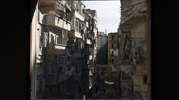 The destruction of Aleppo as seen through a window in the city's al-Shaar neighbourhood.