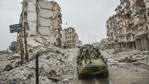 Palliate this? Russian troops in the devastated Syrian city of Aleppo. 