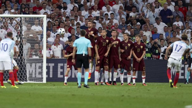 England's Eric Dier, right, scores against Russia from a free kick in the 73rd minute in Marseille at Euro 2016.
