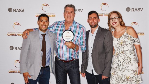 Hugh Souyave, Peter Bragg, Daniel Moscaritolo and Joanna Michajlow from Bean!Roasters by Cosmorex accepting their 2017 Champion Australian Roaster trophy at the Australian International Coffee Awards.
