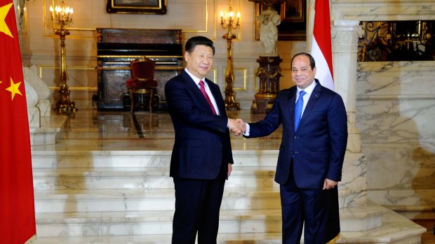 Egyptian President Abdel Fattah al-Sissi, right, shakes hands with Chinese President Xi Jinping.