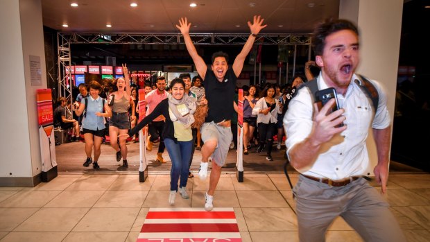 Crowds rush the doors at Myer for the Boxing Day sales last year.