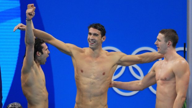 Cody Miller, Michael Phelps and Ryan Murphy celebrate winning gold.
