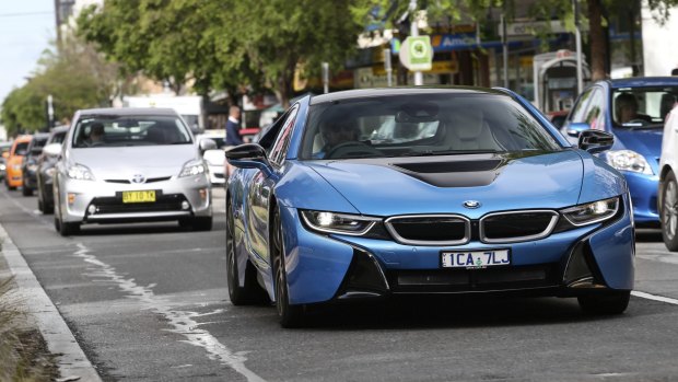 Fuel-sippers: BMW's i8, front, and the Toyota Prius i-Tech.