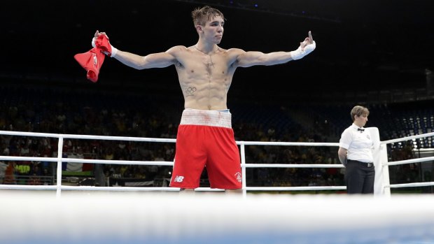 Ireland's Michael Conlan walks around with his shirt off after losing his fight.
