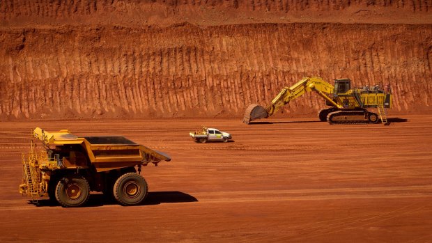 Machinery operates in a pit at Rio Tinto Group's West Angelas iron ore mine in Pilbara.