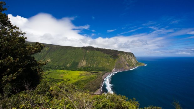 Waipi'o Valley is a hidden tropical paradise surrounded by sheer cliffs and coast.
