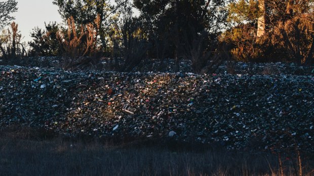The piles of glass from ACT recycling bins dumped near the Federal Highway at Lake George.