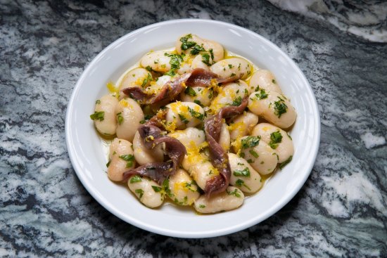 Giant white beans with anchovies and citrus zest are part of the new all-day menu of small plates.