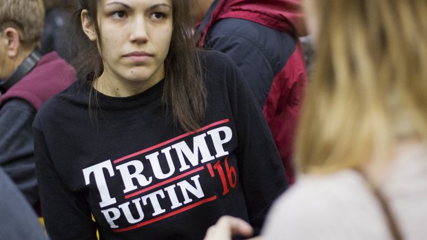 A woman wears a shirt reading 'Trump Putin '16', hinting at the presidential candidate's rumoured support of the Russian president.