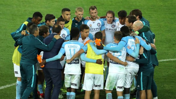 United: Melbourne City coach Michael Valkanis speaks to his players after the draw with Brisbane.