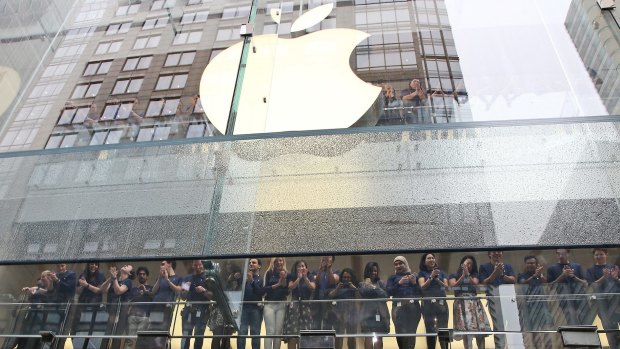 Staff at the Apple store in Sydney. Apple is one of many US multinationals that has been criticised for not paying enough tax in Australia. 
