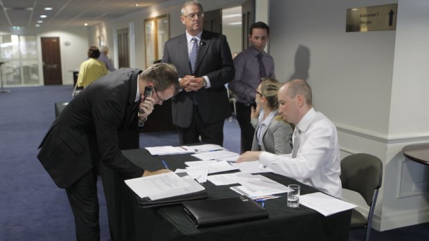 Wickham Securities creditors pictured meeting in Brisbane in 2013. Judge Tony Moynihan said it was likely Garth Robertson's conduct as CEO took a "devastating" toll on clients of the company.