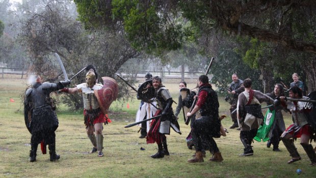 Combatants do battle with latex swords and elaborate armor. 