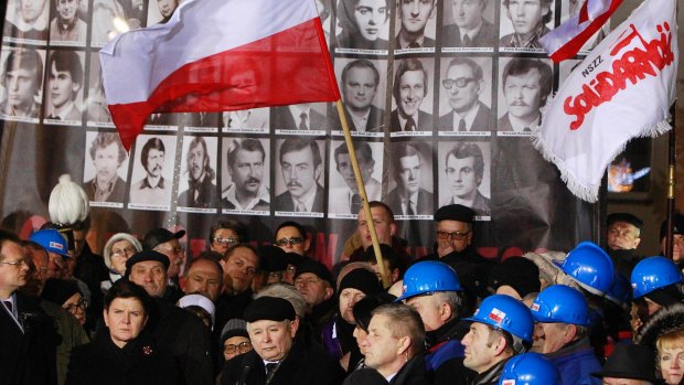 Law and Justice party leader Jaroslaw Kaczynski, centre, speaks during the 35th anniversary of the introduction of martial law at Three Crosses Square in Warsaw.