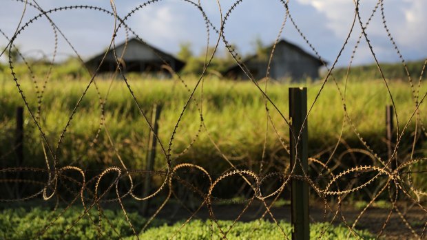 Grass grows around razor wire at Camp X-Ray, a closed section of the prison.